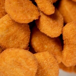 Golden crispy chicken nuggets perfectly breaded for a tasty treat.